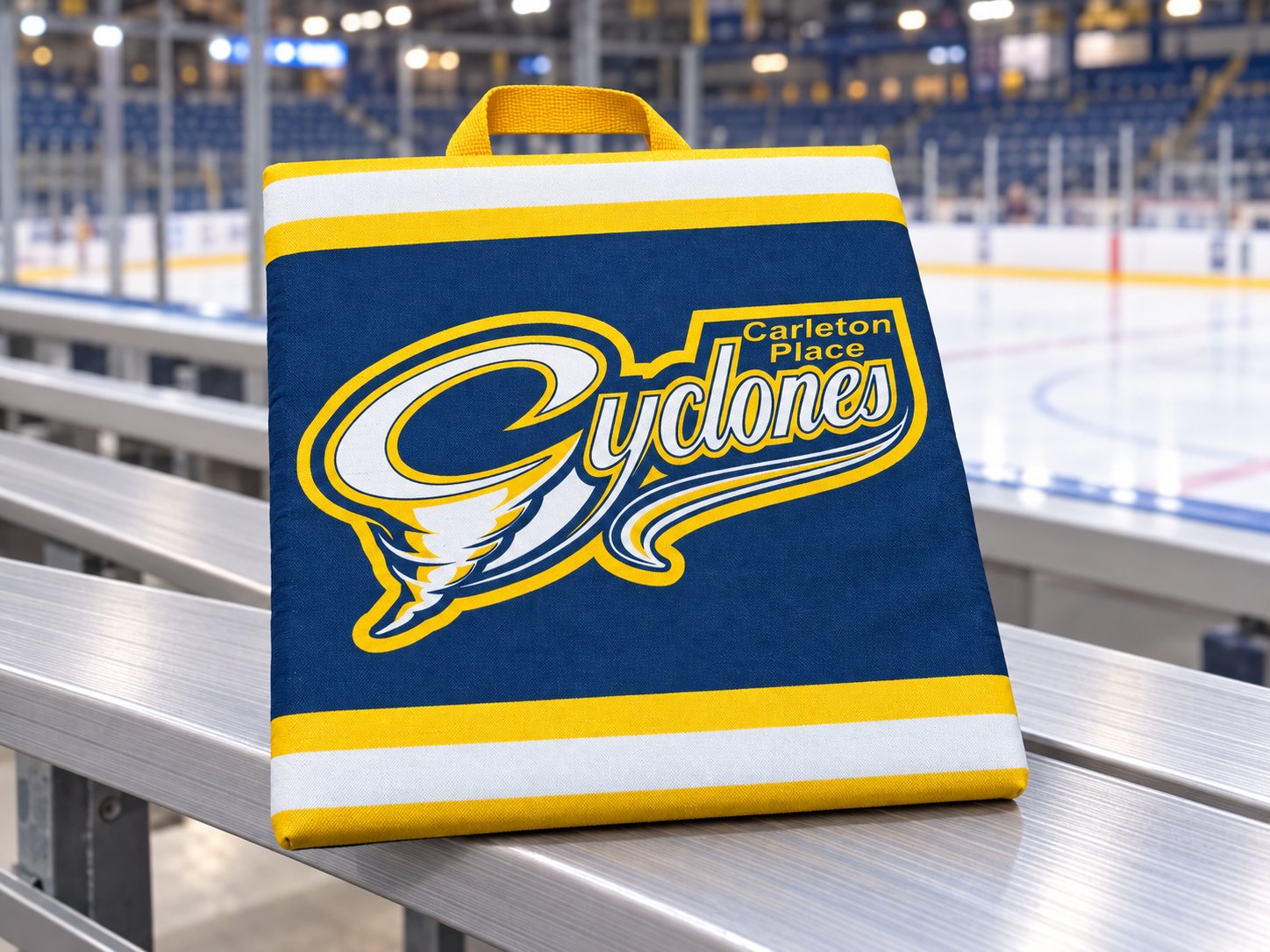 Custom stadium seat cushion with Carleton Place Cyclones logo on arena bleachers